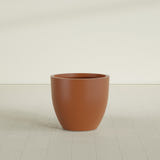 Wannsee Round Planter in Matte Terra Cotta, 33"D × 29"H, shown empty