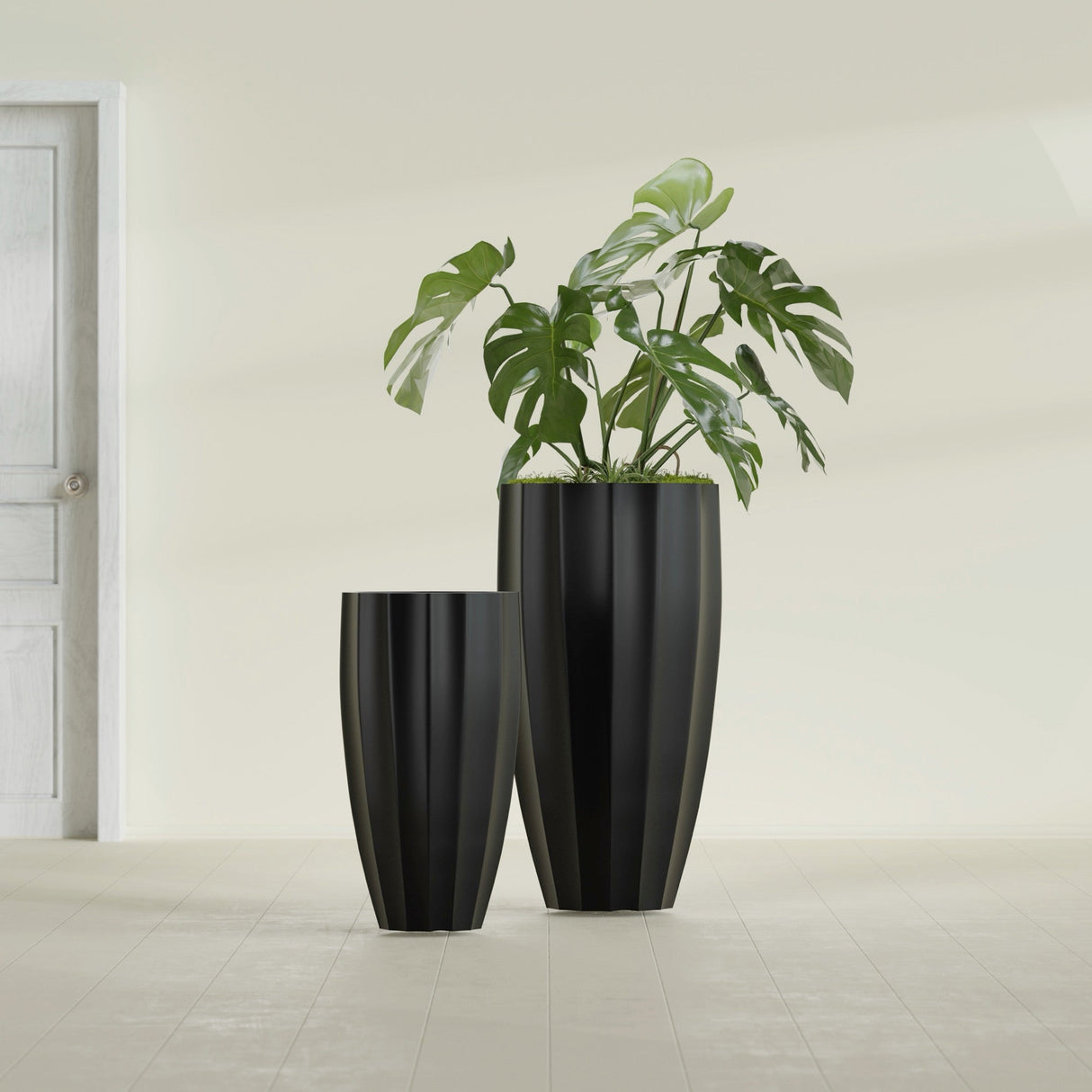 San Jose Tall Fluted fiberglass planter in Matte Black, size range, in a sunlit interior