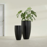 San Jose Tall Fluted fiberglass planter in Matte Black, size range, in a sunlit interior