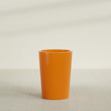 Tegel Round Tapered Planter in Gloss Tangerine, 22"D × 30"H, shown empty
