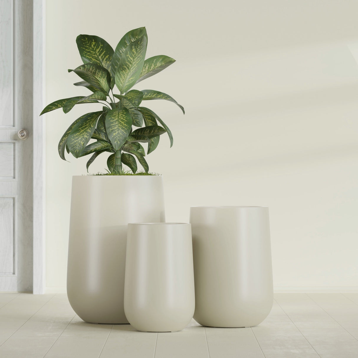 Hayden Urn fiberglass planter in Satin Beige, size range, in a sunlit interior