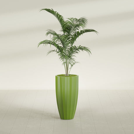 San Jose Tall Fluted fiberglass planter in Satin Green, shown planted, in a sunlit interior