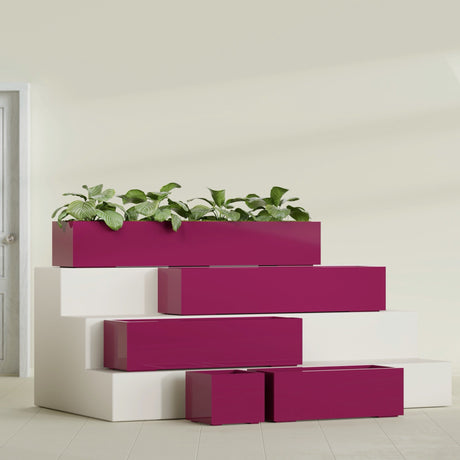 Cuba Corner fiberglass planter in Gloss Eggplant, size range, in a sunlit interior