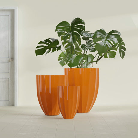 Alicante Fluted fiberglass planter in Gloss Tangerine, size range, in a sunlit interior