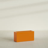 Hollywood Narrow Rectangular Planter in Gloss Tangerine, 36"L × 12"D × 24"H, shown empty