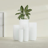Saint Tropez Bullet Round fiberglass planter in Gloss Bright White, size range, in a sunlit interior