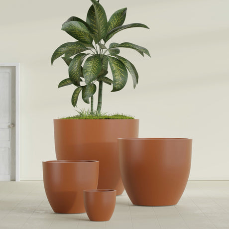 Wannsee Round fiberglass planter in Matte Terra Cotta, size range, in a sunlit interior