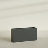 Hollywood Narrow Rectangular Planter in Matte Charcoal, 48"L × 12"D × 24"H, shown empty