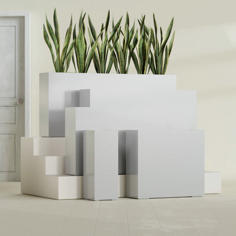 Delray Corner fiberglass planter in Metallic Silver, size range, in a sunlit interior