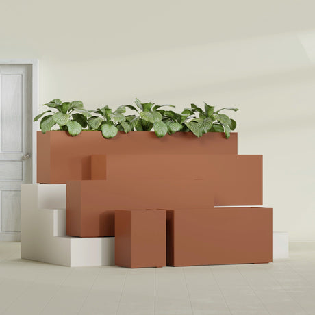 Miami Corner fiberglass planter in Matte Terra Cotta, size range, in a sunlit interior