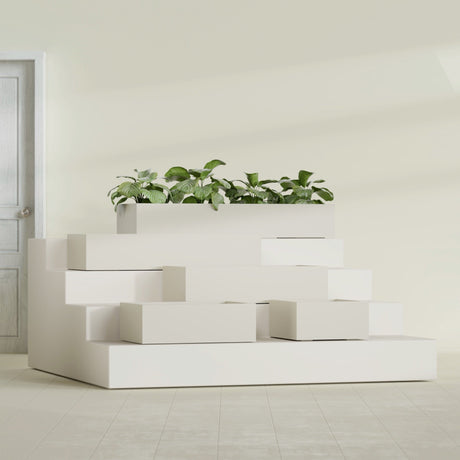 Antwerp Corner fiberglass planter in Satin Beige, size range, in a sunlit interior