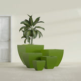 Lima Tapered Square fiberglass planter in Satin Green, size range, in a sunlit interior