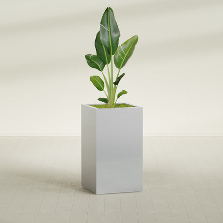 Darwin Rectangular fiberglass planter in Metallic Silver, shown planted, in a sunlit interior