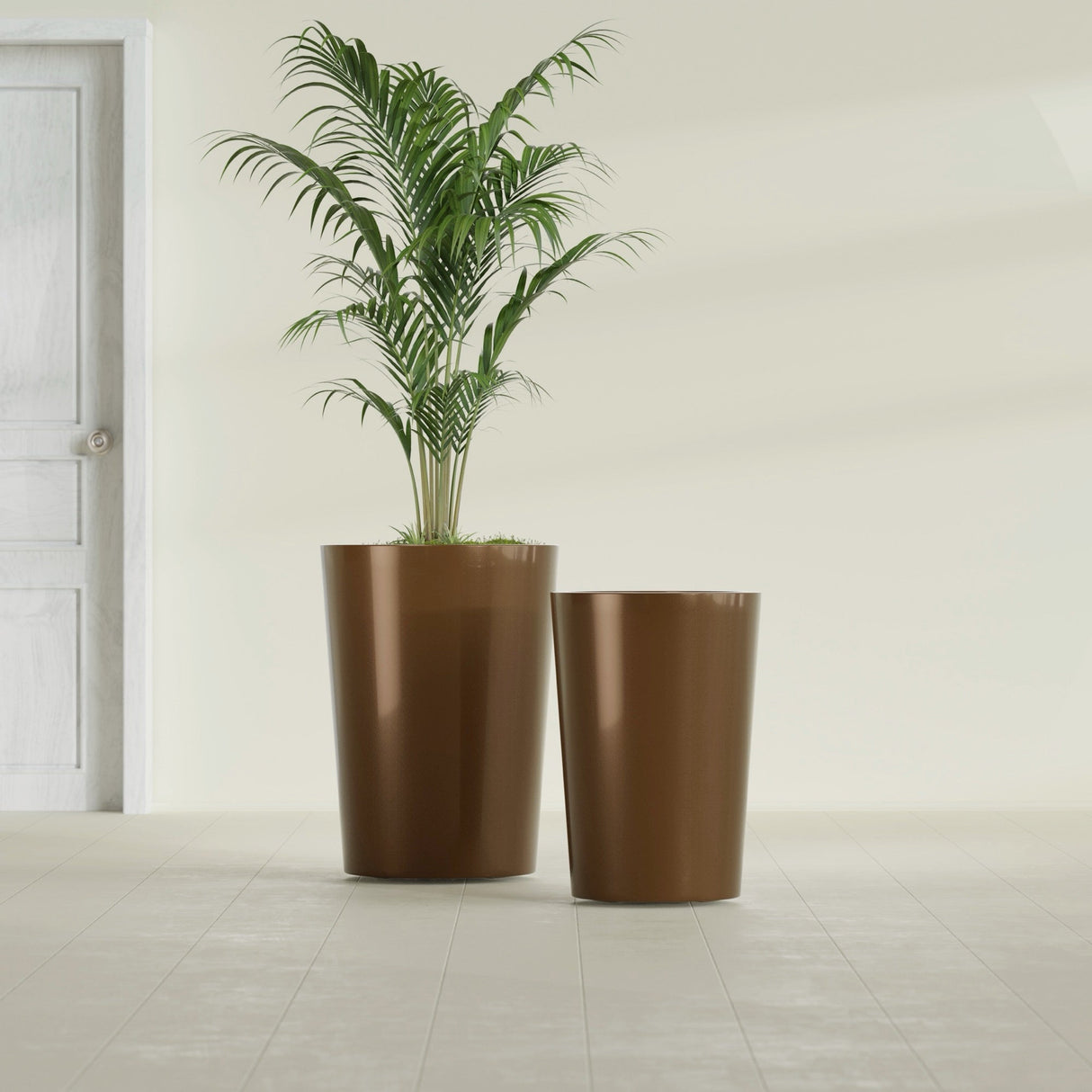 Tegel Round Tapered fiberglass planter in Metallic Bronze, size range, in a sunlit interior