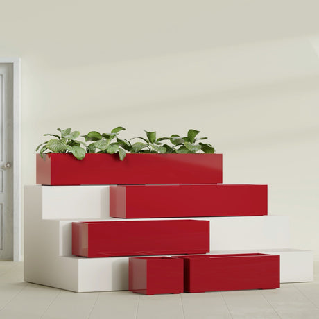 Cuba Corner fiberglass planter in Gloss Red, size range, in a sunlit interior