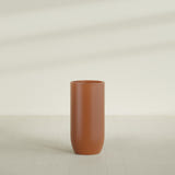 Saint Tropez Bullet Round Planter in Matte Terra Cotta, 24"D × 50"H, shown empty
