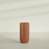 Saint Tropez Bullet Round Planter in Matte Terra Cotta, 24"D × 50"H, shown empty