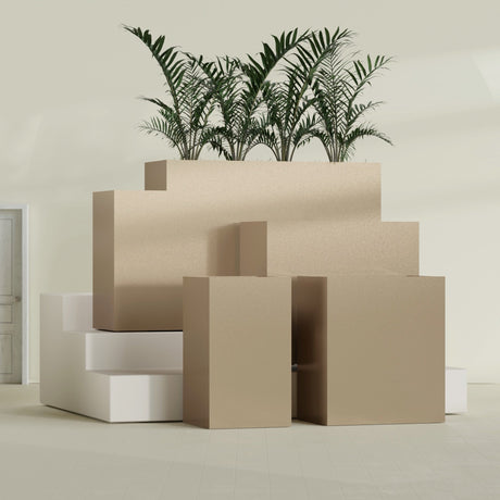 Darwin Corner fiberglass planter in Gloss Metallic Gold, size range, in a sunlit interior
