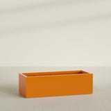 Torino Wide Rectangular Planter in Gloss Tangerine, 60"L × 24"D × 18"H, shown empty