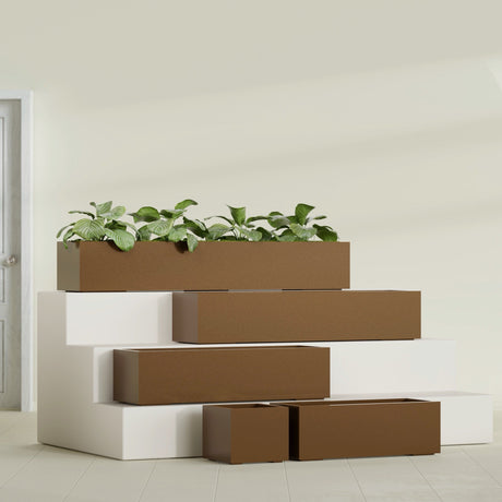 Cuba Corner fiberglass planter in Metallic Bronze, size range, in a sunlit interior