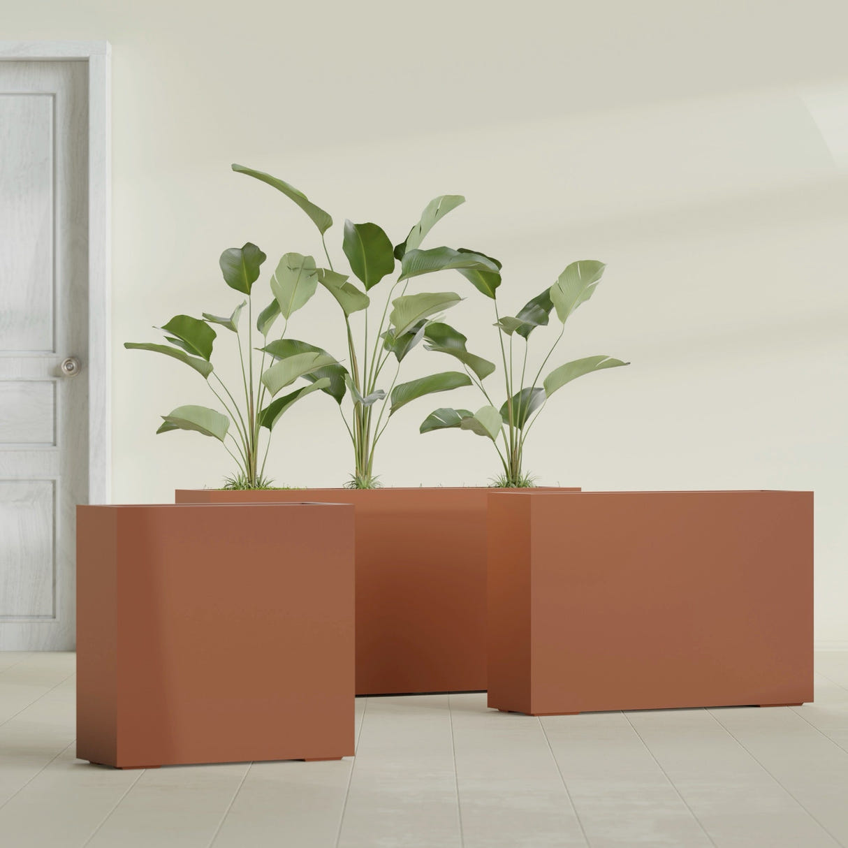 Milano Narrow Rectangular fiberglass planter in Matte Terra Cotta, shown planted, in a sunlit interior