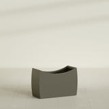 Seoul Curved Planter in Matte Bronze, 36"L × 16"D × 24"H, shown empty