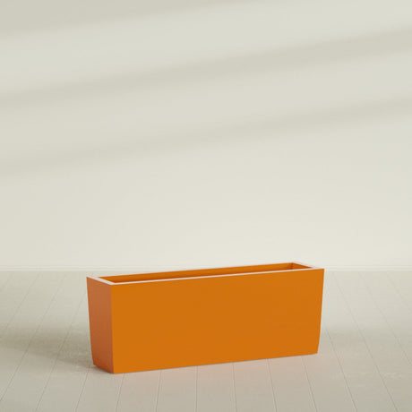 Panama Tapered Rectangular Planter in Gloss Tangerine, 48"L × 12"D × 18"H, shown empty