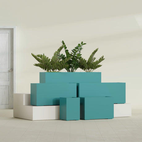 Tolga Corner fiberglass planter in Satin Seafoam Green, size range, in a sunlit interior