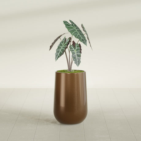 Hayden Urn fiberglass planter in Metallic Bronze, shown planted, in a sunlit interior