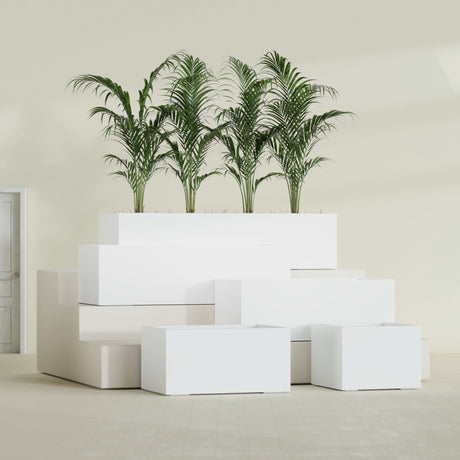 Torino Corner fiberglass planter in Matte Bright White, size range, in a sunlit interior