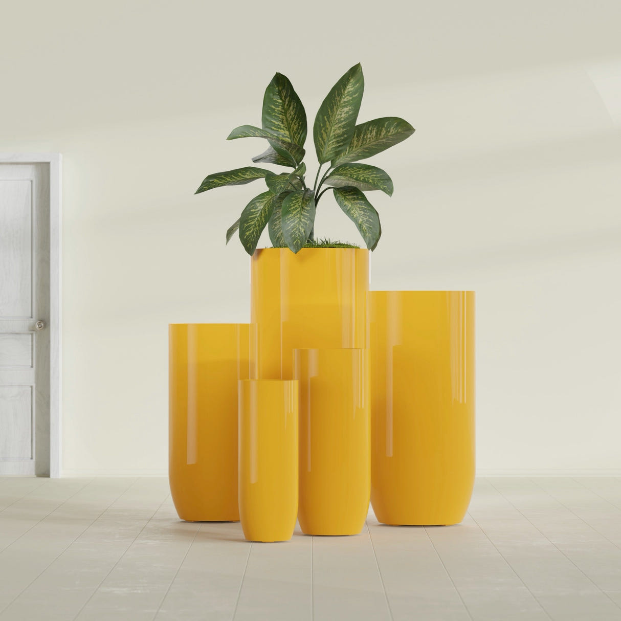 Saint Tropez Bullet Round fiberglass planter in Gloss Saffron, size range, in a sunlit interior