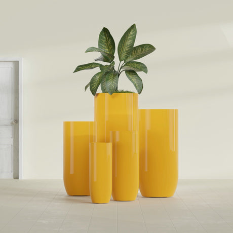 Saint Tropez Bullet Round fiberglass planter in Gloss Saffron, size range, in a sunlit interior