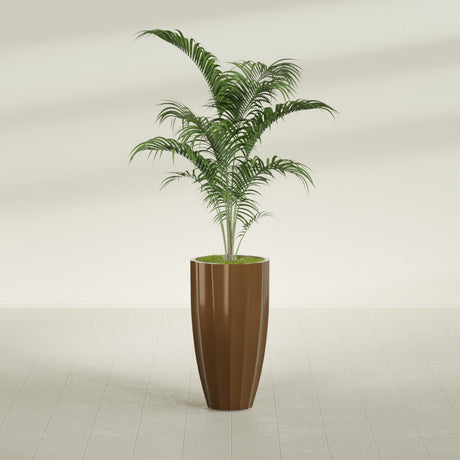 San Jose Tall Fluted fiberglass planter in Metallic Bronze, shown planted, in a sunlit interior