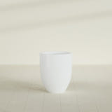 Valencia Tapered Round Planter in Matte Bright White, 20"D × 23"H, shown empty