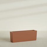 Panama Tapered Rectangular Planter in Matte Terra Cotta, 48"L × 12"D × 18"H, shown empty