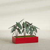Antwerp Rectangular fiberglass planter in Gloss Red, shown planted, in a sunlit interior