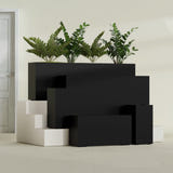 Hollywood Narrow Rectangular fiberglass planter in Matte Black, size range, in a sunlit interior