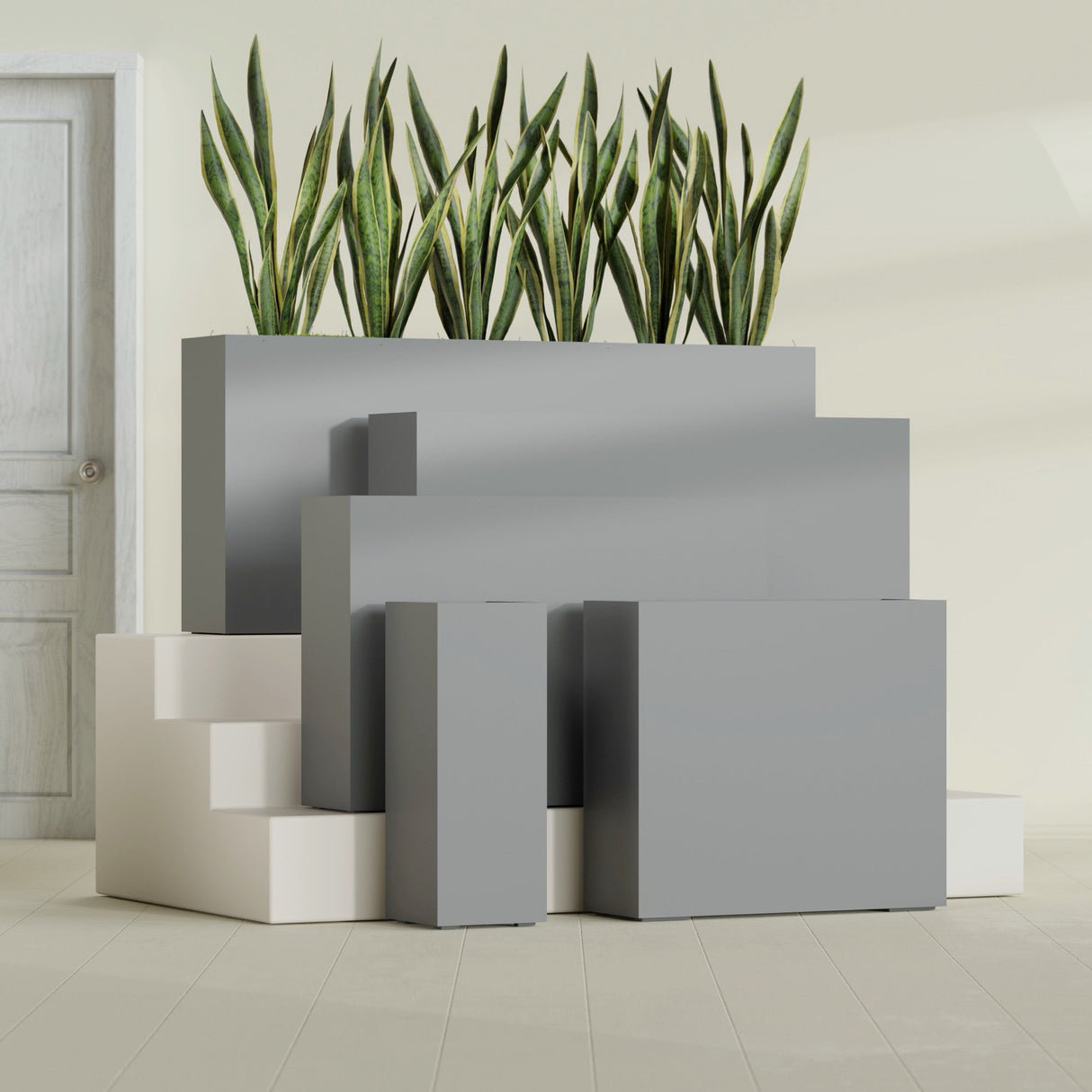 Delray Corner fiberglass planter in Matte Gunmetal, size range, in a sunlit interior