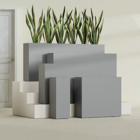Delray Corner fiberglass planter in Matte Gunmetal, size range, in a sunlit interior