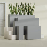 Delray Rectangular fiberglass planter in Matte Gunmetal, size range, in a sunlit interior