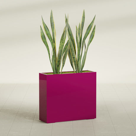 Perth Corner fiberglass planter in Gloss Eggplant, shown planted, in a sunlit interior