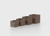 Asheville Cube fiberglass planter in Woodland, the four sizes shown together
