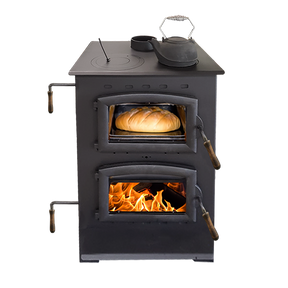 Buck Stove Homesteader Wood Cook Stove with glowing flames below and loaf of bread baking inside the oven compartment