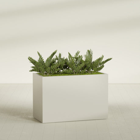 Brisbane Corner fiberglass planter in Satin Beige, shown planted, in a sunlit interior