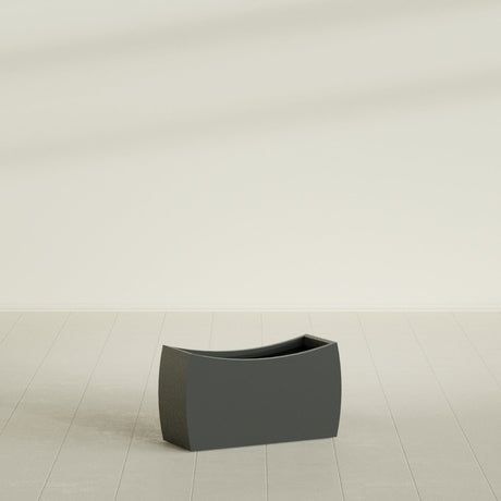 Seoul Curved Planter in Matte Charcoal, 32"L × 12"D × 18"H, shown empty