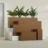 Hollywood Narrow Rectangular fiberglass planter in Metallic Bronze, size range, in a sunlit interior