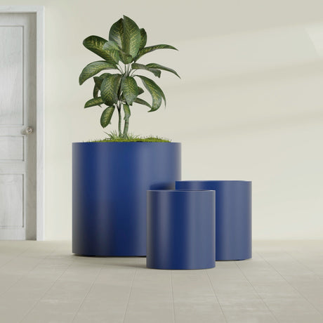Rio Grande Cylinder fiberglass planter in Matte Cobalt Blue, size range, in a sunlit interior