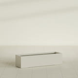 Cuba Low Rectangular Planter in Satin Beige, 48"L × 14"D × 12"H, shown empty