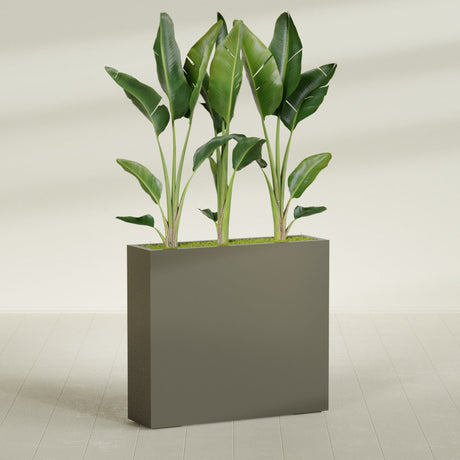 Amesbury Narrow Rectangular fiberglass planter in Matte Bronze, shown planted, in a sunlit interior