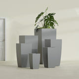 Toulan Tapered Square fiberglass planter in Matte Gunmetal, size range, in a sunlit interior